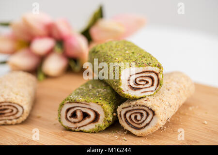 slice of Homemade Sweet roll with chocolate and vanilla on white background Stock Photo