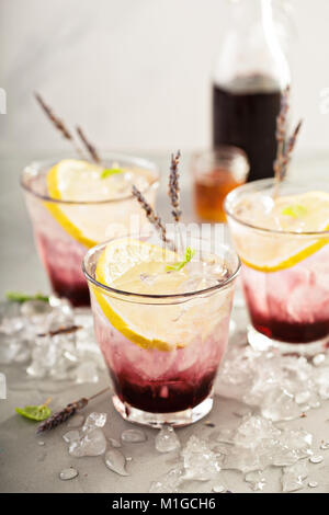 Lavender syrup lemonade with fresh lemons and honey Stock Photo