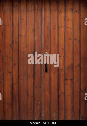 Wooden brown door, backdrop with latch and padlock, close up, details