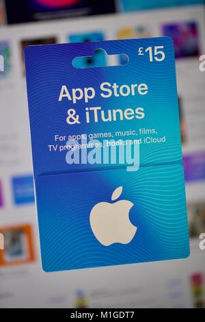 View on Apple Itunes and App Store Gift Voucher Card Hold by Hand