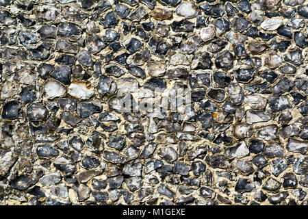 Old traditional flint infill wall close up full frame Stock Photo
