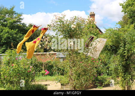 A giant's clothes drying on the washing line at the National Trust property, Mottisfont, in Romey. Stock Photo