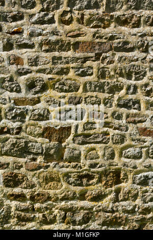 A neatly pointed restored stone wall full frame texture background Stock Photo