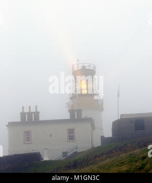 Sumburgh lighthouse in thick mist, Shetland, Scotland, UK. Stock Photo