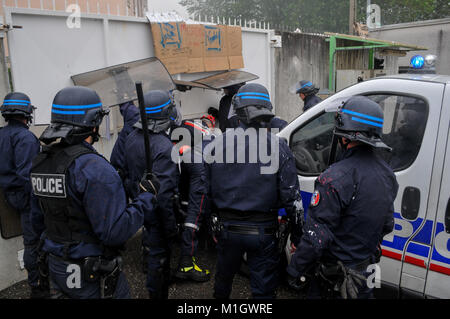 Police officers protect ARKEMA industrial site from protesters intrusion, Pierre-Benite, France Stock Photo