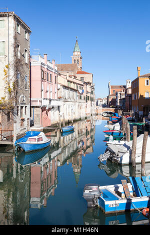 Reflections in Canal Vena, Chioggia, Venice, veneto,  Italy, a fishing port  in the southern Venetian lagoon on the Adriatic with moored  boats Stock Photo