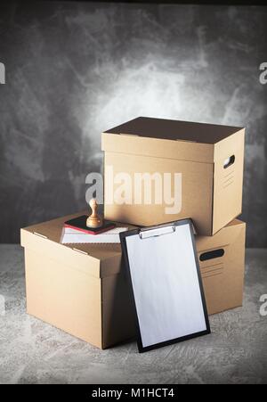Cardboard box on grey concrete background Stock Photo