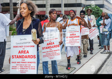 Miami Florida,Southeast Financial Center,Southeast,centre,protest,labor demonstration,signs,wages,fringe benefits,picket line,Black woman female women Stock Photo