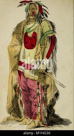 Full length, color illustration of Sioux Chief Wahktageli aka the 'Big Soldier, ' wearing red face paint, a multicolor feather headdress, an elaborately decorated tunic, an animal hide cloak, trousers, and boots, and holding an axe, from the book ' Thrilling adventures among the Indians: comprising the most remarkable personal narratives of events in the early Indian Wars, as well as of incidents in the recent Indian hostilities in Mexico and Texas, ' authored by John Frost, 1854. () Stock Photo