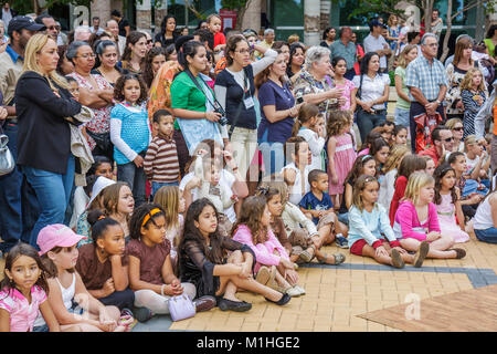 Miami Florida,Carnival Center,Thompson Plaza for the Arts,Free Multicultural Music Festival,festivals,celebration,fair,audience,crowd,watches performa Stock Photo