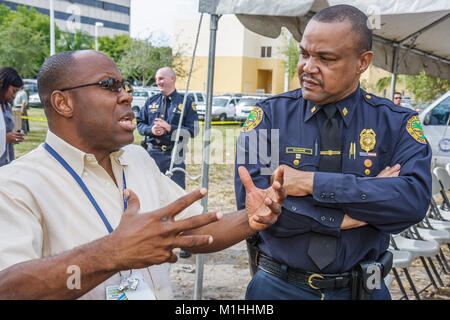 Miami Florida,College of Policing,groundbreaking ceremony,law enforcement,education,criminology,Black police,policeman,city official,man men male,talk Stock Photo