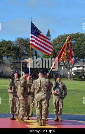 Col. Robert Ryan, commander, 3rd Brigade Combat Team, “Broncos,” 25th Infantry Division, transfers responsibility from outgoing brigade senior enlisted advisor, Command Sgt. Maj. Alan E. Michaud at Weyand Field, Schofield Barracks, Hawaii, on Jan. 5, 2018. Command Sgt. Maj. Michael J. Spear assumed responsibility of the brigade from Michaud.  (U.S. Army Stock Photo