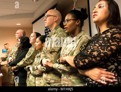 William Beaumont Army Medical Center Soldiers and staff join hands during a rendition of the gospel song “We Shall Overcome,” during the annual Martin Luther King Jr. Day observance at WBAMC, Jan. 19. The observance celebrated the life and accomplishments of Dr. Martin Luther King, Jr. and his impact on today’s culture. Stock Photo