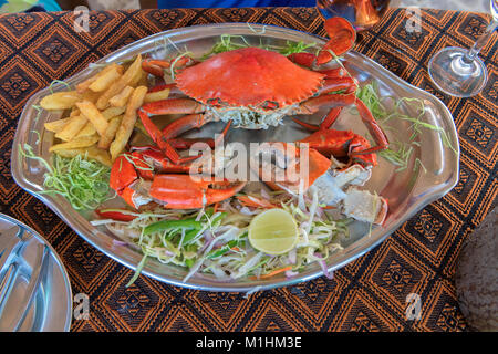 Big crabs and vegetable in beach restaurant, GOA, India. Stock Photo