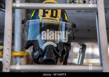 Airman 1st Class Orlando Chapman, 23d Civil Engineer Squadron (CES) firefighter, holds a ladder during extraction training, Jan. 25, 2018, at Moody Air Force Base, Ga. Firefighters from the 23d CES conducted A-10C Thunderbolt II extraction training to practice extinguishing an aircraft fire and quickly rescuing a pilot from an A-10. The 23d CES holds the extraction training twice annually and are evaluated on the amount of time it takes them to rescue a pilot from the cockpit. (U.S. Air Force Stock Photo