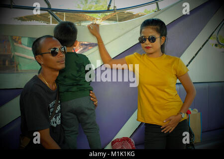 Thai family of three on a boat in Phuket, Thailand. 19-Jan-2018 Stock Photo