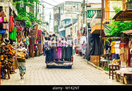 Indigenous Maya kids using public transpart by small village in Guatemala Stock Photo