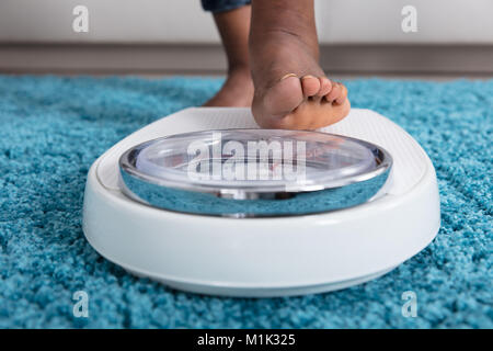 Human Foot On Weighing Scale Stock Photo - Alamy