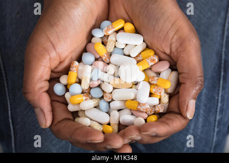 High Angle View Of A Human Hand With Variety Of Medicine Pills Stock Photo