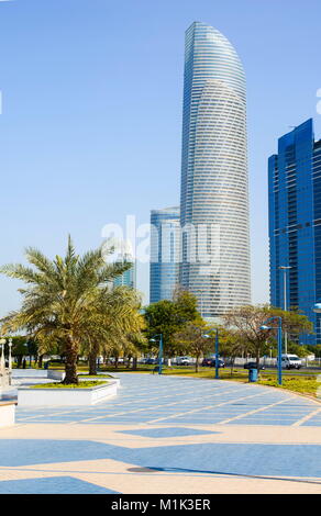 Abu Dhabi Corniche walking area with landmark view of modern buildings on Corniche road, UAE Stock Photo