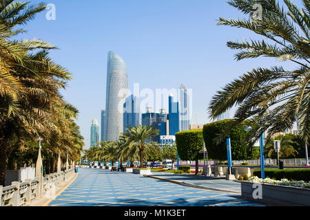 Abu Dhabi Corniche walking area with landmark view of modern buildings on Corniche road, UAE Stock Photo