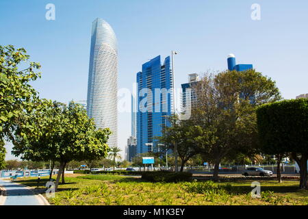 Abu Dhabi Corniche walking area with landmark view of modern buildings on Corniche road, UAE Stock Photo