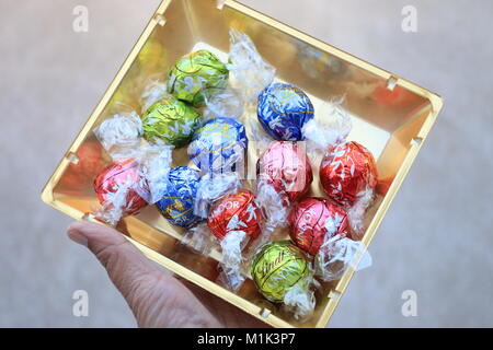 Close up of Assorted Lindt Lindor Chocolates in gold colour box Stock Photo