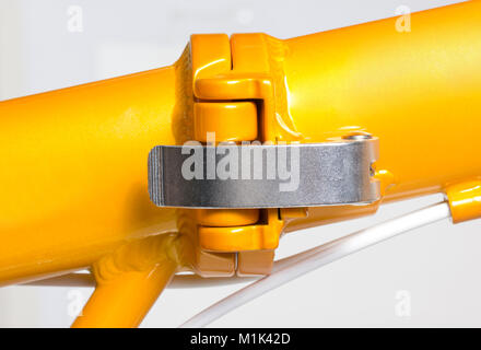 Close up of hinge at middle of frame of folding bicycle. Stock Photo
