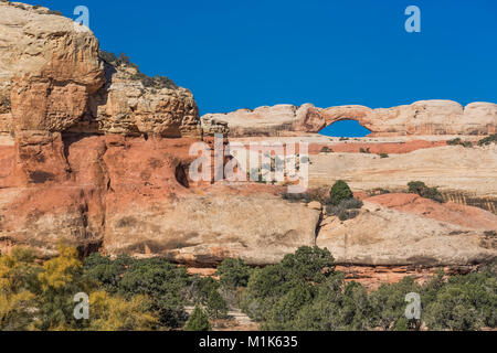 Natural sandstone arch near Kirk's Cabin within Salt Creek Canyon in The Needles District of Canyonlands National Park, Utah, USA Stock Photo
