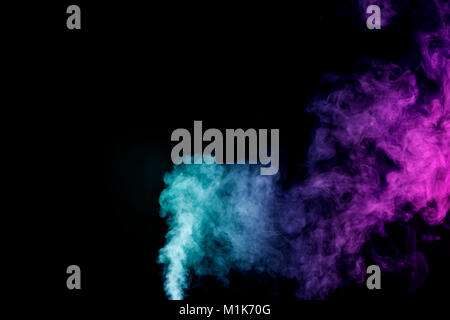 Dense multicolored smoke of   red and blue colors on a black isolated background. Background of smoke vape Stock Photo