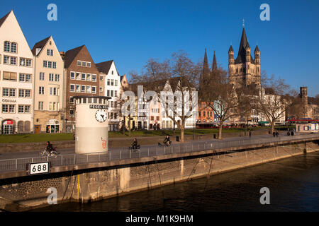 Germany, Cologne, water level clock in the old part of the town at the Frankenwerft, the cathedral and the church Gross St. Martin.  Deutschland, Koel Stock Photo