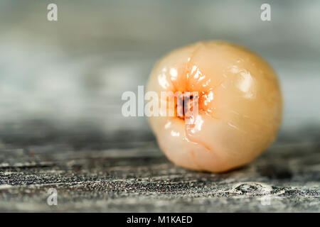 Peeled lychee on wooden background close Stock Photo