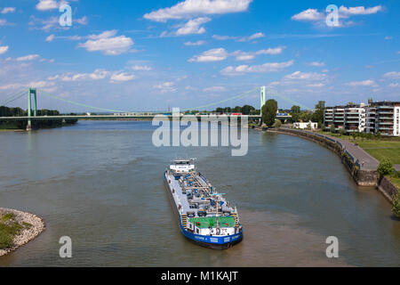 Germany, Cologne, tanker arrives the harbor in the district Muelheim, in the background the Muelheimer bridge across the river Rhine.  Deutschland, Ko Stock Photo
