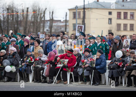 ST. PETERSBURG, RUSSIA-MAY 9, 2017: Russian adults and children hold a pictures of soldiers of World War Two. Event is called the 'Immortal Regiment'  Stock Photo