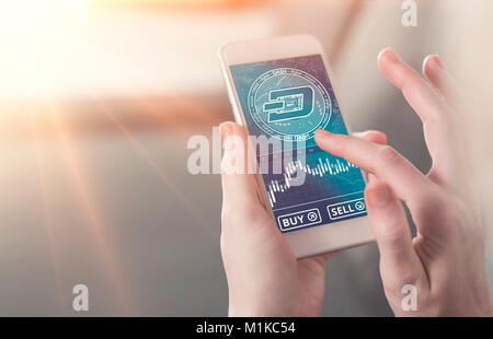 Dash coin symbol on mobile app screen with big BUY and SELL buttons. Dash coin on stock market. New digital money. Stock Photo