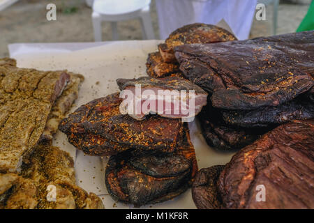 Smoked pork leg, chiromeri, a meat delicacy in Cyprus, displayed for sale in a village. Stock Photo