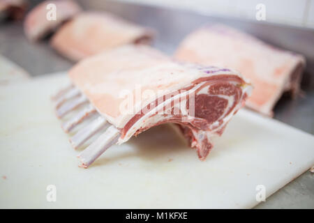 Close up of mutton / lamb ribs being sawed in a butchery Stock Photo