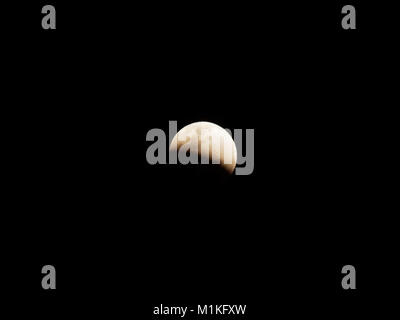 Super blue blood moon with partial lunar eclipse over dark sky background Stock Photo