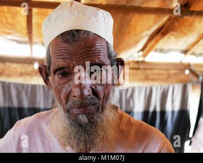 January 18, 2018 - Cox'S Bazar, Bangladesh - An elderly Rohingya man seen at the Kutupalong Refugee Camp.Even Pope Francis was not allowed to say a word ''Rohingya'' in Myanmar. More than one million Rohingya refugees who were forced to fled from Rakhine state in Myanmar in August 2017 to save their lives from ethnic cleansing are living in very basic conditions in the refugee camps in Bangladesh and their future is very uncertain. They are afraid to return home - but repatriation treaty was already signed to return them to their homeland where they are not welcomed. (Credit Image: © Jana Cav Stock Photo