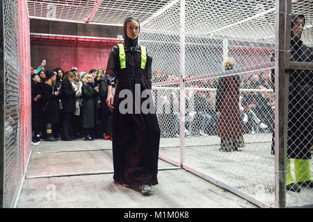 Copenhagen, Denmark 31 January, 2018. A model walks the runway at the HAN Kjøbenhavn show presenting thre new Autumn/Winter 18 collection during Copenhagen Fashion Week A/W18  The show took place in a warehouse designed as a mental hospital inside a cage of wire fence. Credit: OJPHOTOS/Alamy Live News Stock Photo