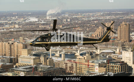 A U.S. Customs and Border Protection, Air and Marine Operations, UH-60 Black Hawk helicopter flies over Minneapolis, Minnesota, as air interdiction agents conduct flight operations in the proximity of U.S. Bank Stadium in advance of Super Bowl LII in Minneapolis, Minn., Jan. 29, 2018. U.S. Customs and Border Protection photo by Glenn Fawcett Stock Photo