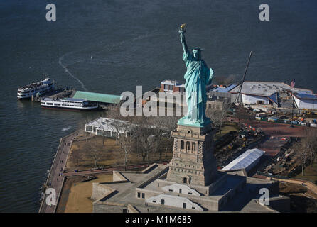 An aerial view of the Statue of Liberty, on Liberty Island in New York Harbor, as seen from a New Jersey National Guard UH-60L Black Hawk helicopter during a training flight, Jan. 24, 2018. Army aviators from the 1st Assault Helicopter Battalion, 150th Aviation Regiment are required to familiarize themselves with the Hudson Special Flight Rules Area over New York City. (U.S. Air National Guard photo by Master Sgt. Matt Hecht) Stock Photo