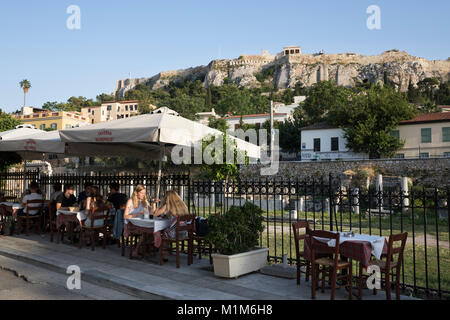Outdoor restaurant on Epaminonda in the Monastiraki area with the Acropolis behind, Athens, Greece, Europe Stock Photo
