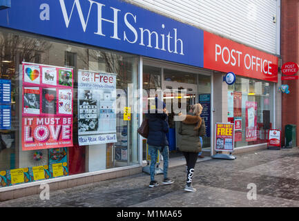 WH Smith, Post Office, Shops, Shoppers, Fashion Stores with Valentines window displays in Chapel Street, Southport, UK Stock Photo