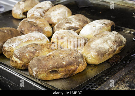 Stuffed sausage sandwich in restaurant, fast and insane food Stock Photo