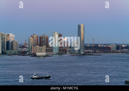 A lunar eclipse over the Hudson River as seen from Tribeca in Manhattan, looking toward Jersey City, N.J. Jan. 31, 2018 Stock Photo