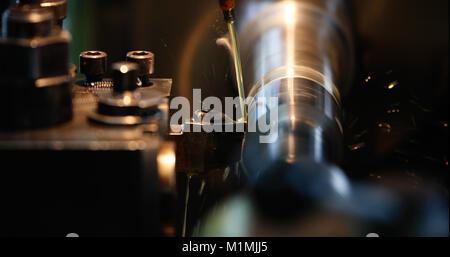 Finishing metal working on high precision grinding machine in workshop Stock Photo
