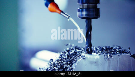 Finishing metal working on high precision grinding machine in workshop Stock Photo