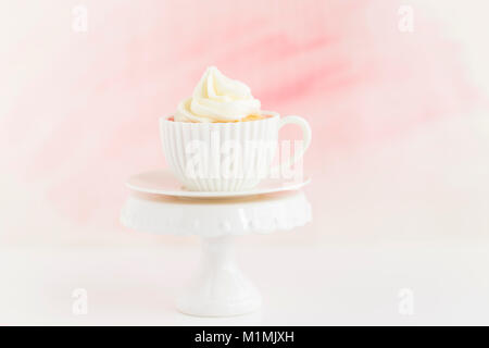 Cupcake with buttercream frosting on a cake stand Stock Photo