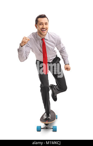 Full length portrait of a businessman riding a longboard and gesturing with his hand isolated on white background Stock Photo